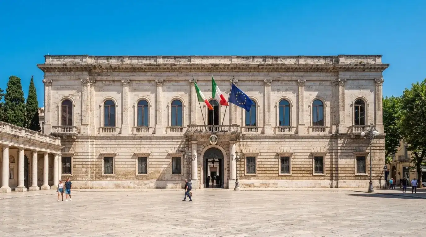 Palazzo istituzionale con bandiere al vento in una piazza soleggiata — casinò che accettano bitcoin